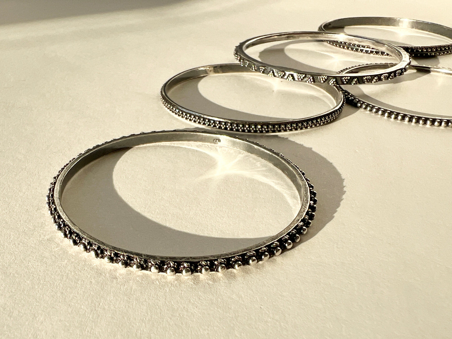 set of five silver bangles