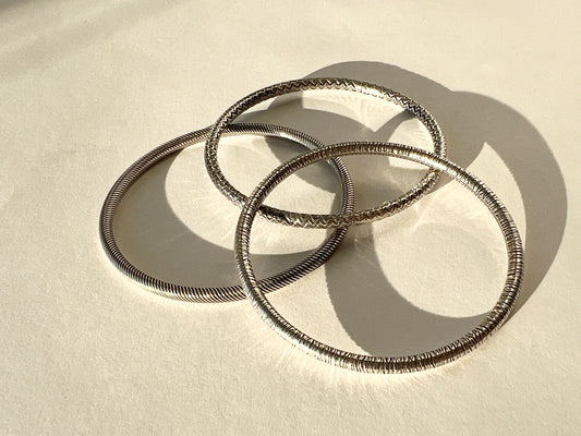 round silver bangles with tension closure