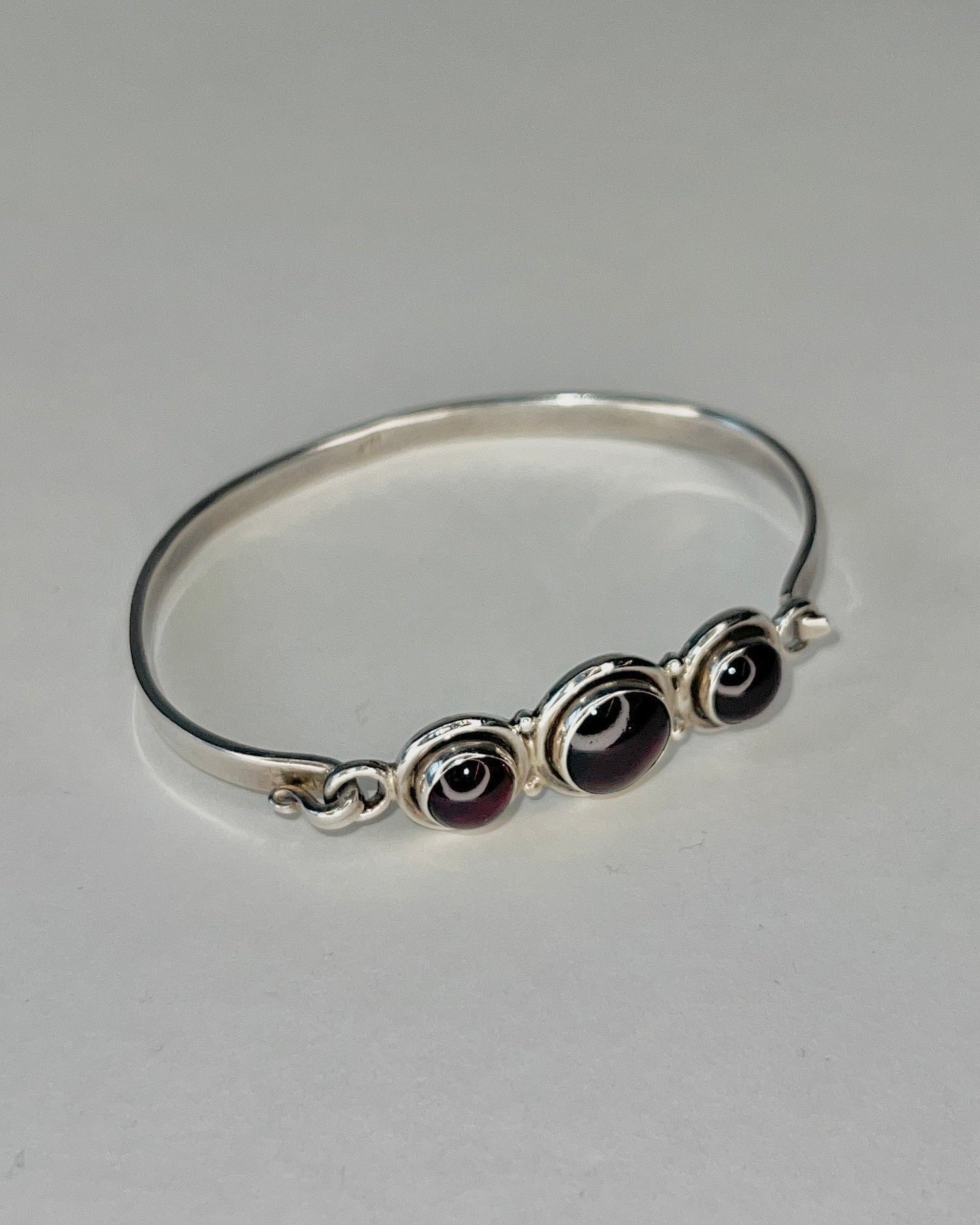 hinged silver bracelet with garnets