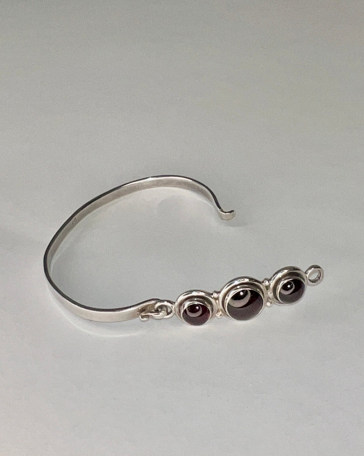 hinged silver bracelet with garnets