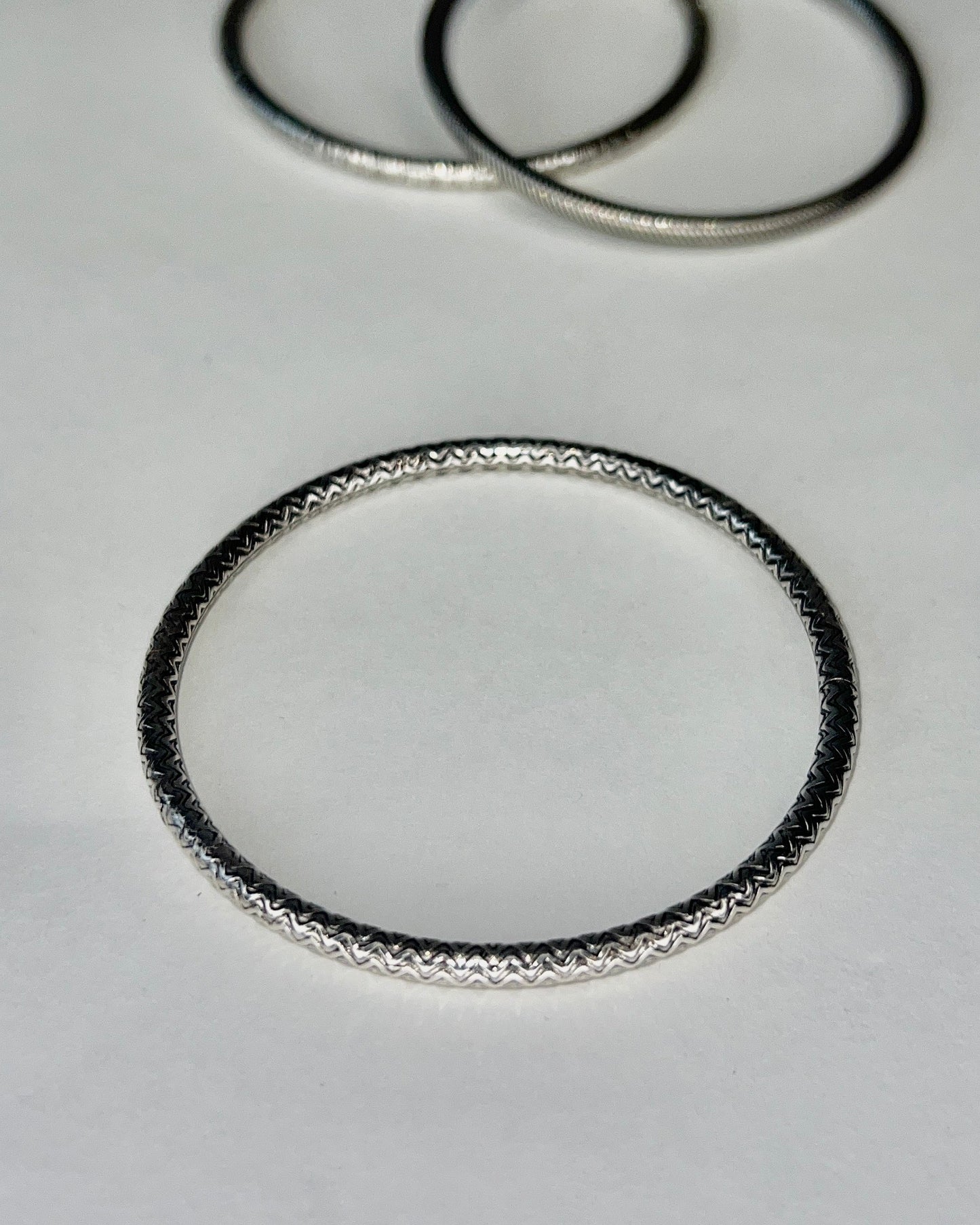 round silver bangles with tension closure