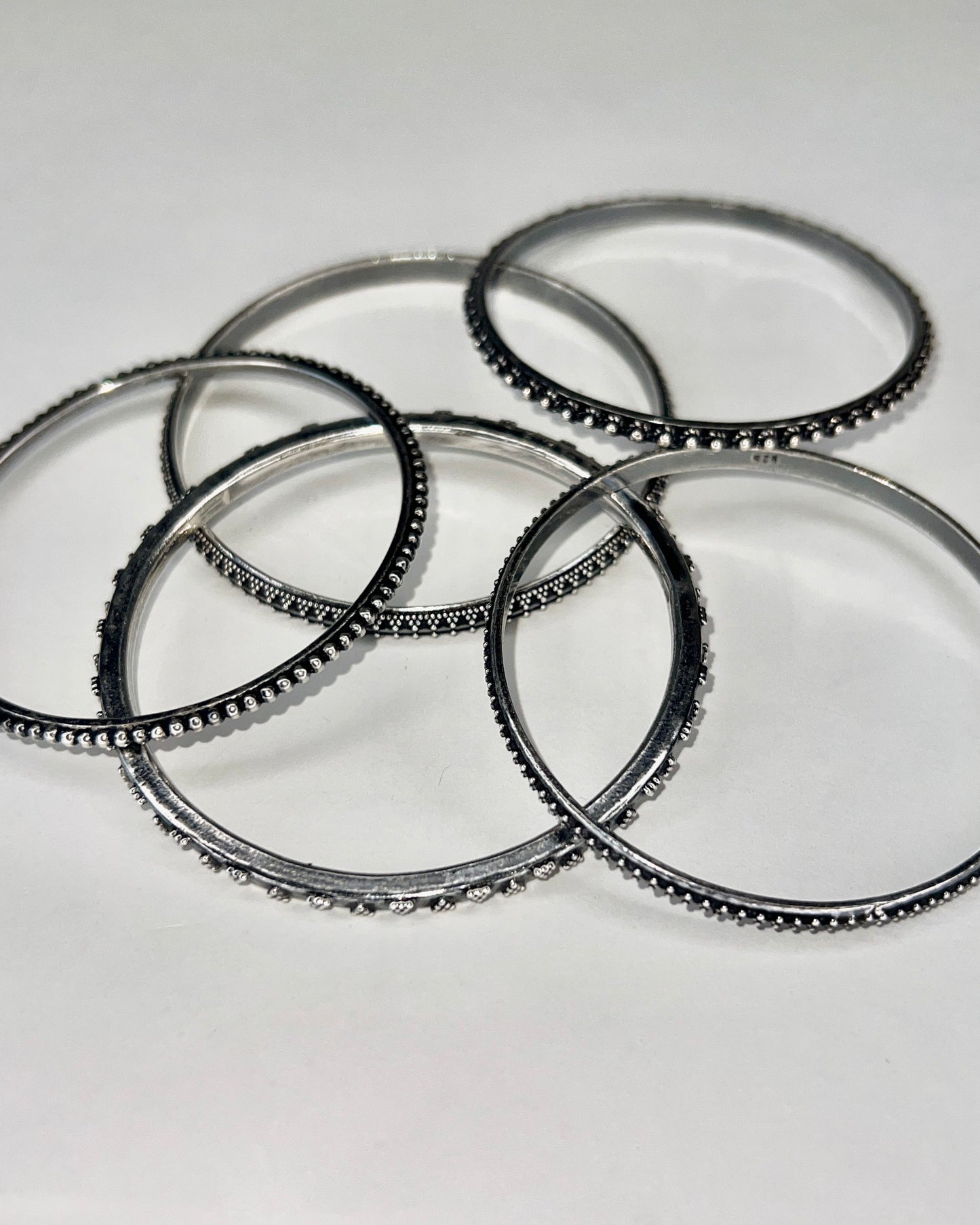 set of five silver bangles