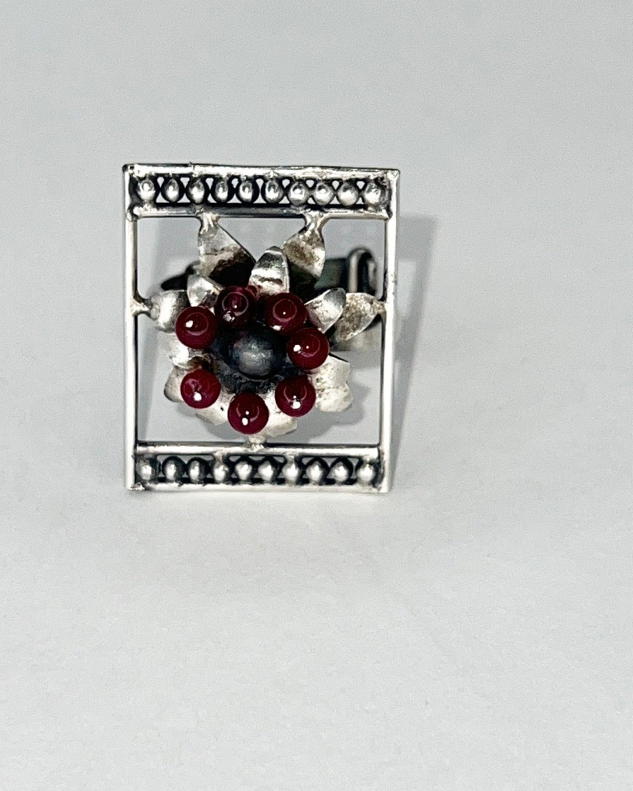 framed flower silver ring with garnet beaads